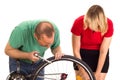 A mechanic repairs a bicycle