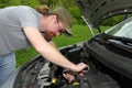 Mechanic repairs a car Royalty Free Stock Photo