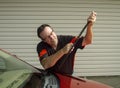 Mechanic Replacing Wiper Blades On A Car