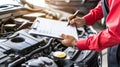 Mechanic s checklist on clipboard for car insurance inspection in garage workshop, auto service. Royalty Free Stock Photo