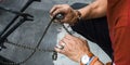 Mechanic Dirty hands fixing a bicycles chain