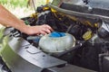 The mechanic`s hands performing a car engine check Royalty Free Stock Photo