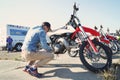 Mechanic serves a motocross motorcycle