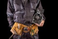 Mechanic with a small combustion engine in hand. A specialist in the repair of internal combustion engines