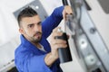 mechanic spraying a car