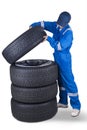 Mechanic and a stack of tires