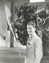 Mechanic standing next to propeller