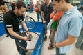 Mechanic teaching people how install a cassette on a wheels hub Royalty Free Stock Photo