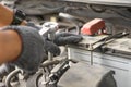 Mechanic, technician man check the car engine in garage. Car service, repair, fixing, checking maintenance working with socket Royalty Free Stock Photo