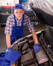 Mechanic technician working at service station