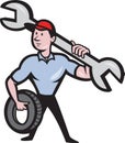 Mechanic With Tire Socket Wrench And Tire Royalty Free Stock Photo