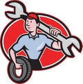 Mechanic With Tire Socket Wrench And Tire Royalty Free Stock Photo