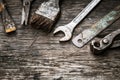 Mechanic tools set on dirty wooden background Royalty Free Stock Photo