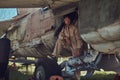 Mechanic in uniform and flight helmet carries out maintenance of an old military bomber in an open-air museum. Royalty Free Stock Photo