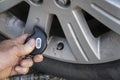 Mechanic Using A Digital Tire Pressure Gauge Royalty Free Stock Photo