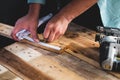 The mechanic is using wood cutting tools in construction Royalty Free Stock Photo
