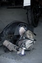 Mechanic welding the exhaust of a motorbike Royalty Free Stock Photo