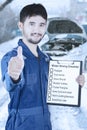 Mechanic with winter driving tips Royalty Free Stock Photo