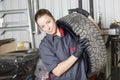 Mechanic woman working on car in his shop Royalty Free Stock Photo