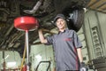 Mechanic woman working on car in his shop Royalty Free Stock Photo