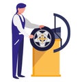 Mechanic worker with tire changer machine Royalty Free Stock Photo