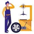 Mechanic worker with tire changer machine Royalty Free Stock Photo