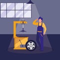 Mechanic worker with tire changer machine Royalty Free Stock Photo