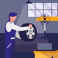 Mechanic worker with tire changer machine Royalty Free Stock Photo