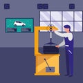 Mechanic worker with tire changer machine Royalty Free Stock Photo