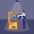 Mechanic worker with tire changer machine Royalty Free Stock Photo