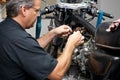 Mechanic working on antique motorcycle