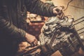 Mechanic working with with motorcycle engine Royalty Free Stock Photo