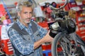 Mechanic workng on motorcycle Royalty Free Stock Photo