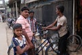 Mechanic in workshop repairing bicycle, Kumrokhali, India