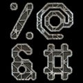 Mechanical alphabet made from rivet metal with gears on black background. Set of symbols percent, at, ampersand and hash