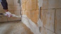 Mechanical application of mortar on the wall. Application of mortar on the wall using an automated machine. Applying