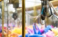 Mechanical claw game machine. Royalty Free Stock Photo
