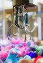 Mechanical claw game machine. Royalty Free Stock Photo