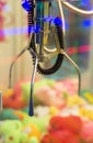 Mechanical claw game machine. Royalty Free Stock Photo