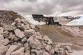 Mechanical conveyor belt to pulverize rock and stone and generate grave