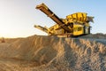 Mechanical conveyor belt to pulverize rock and stone and generate gravel Royalty Free Stock Photo