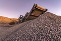 Mechanical conveyor belt to pulverize rock and stone and generate gravel Royalty Free Stock Photo