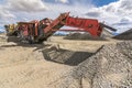 Mechanical conveyor belt to pulverize rock and stone and generate gravel Royalty Free Stock Photo