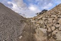 Mechanical conveyor belt to pulverize rock and stone and generate gravel Royalty Free Stock Photo