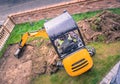 mechanical digger removing turf in front yard, garden for landscaping Royalty Free Stock Photo