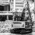 A Mechanical Digger Working On A Building Demolition Construction Project With No People