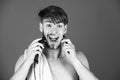 Mechanical or electric shaver. guy shaving hair with electric shaver and safety razor Royalty Free Stock Photo