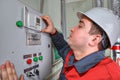 Mechanical Engineer reads the readings on the switchgear panel.