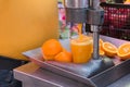 Mechanical juice press. Making orange juice using squeezing machine