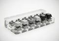 Mechanical keyboard switches displayed in a clear acrylic holder isolated on white background Royalty Free Stock Photo